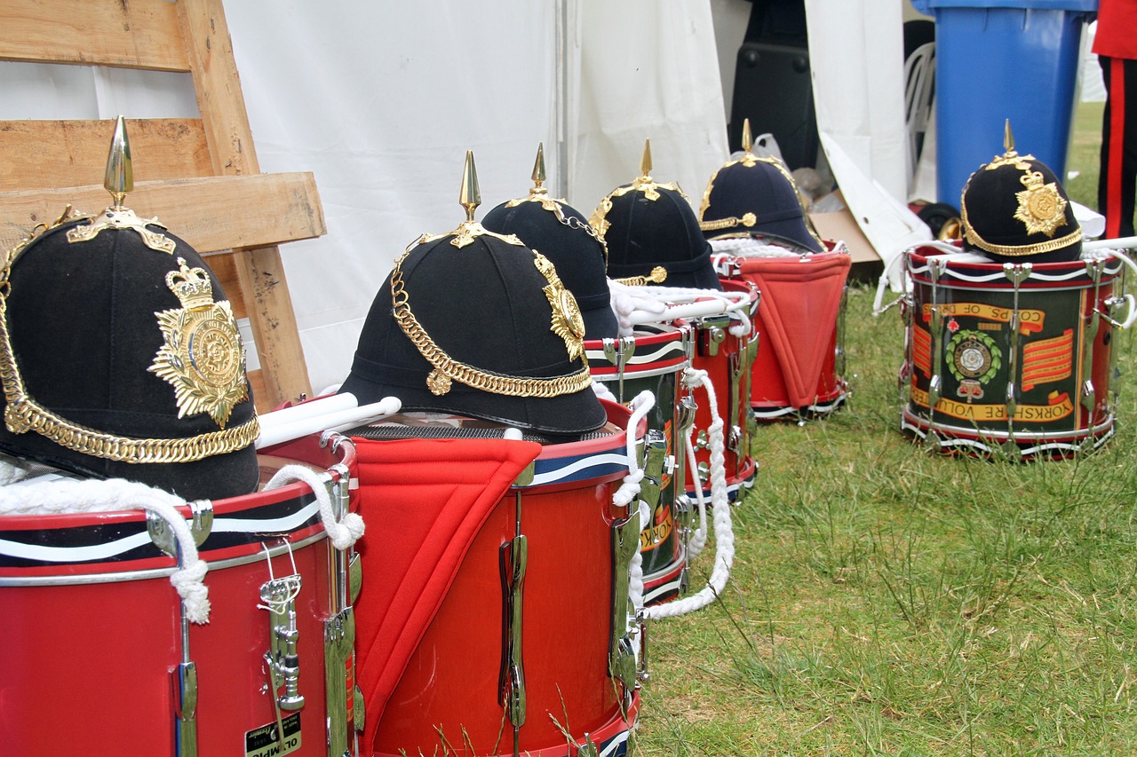 a group of drums sitting on top of a grass covered field, by Robert Brackman, flickr, exquisite helmet detail, military parade, saws, bespoke