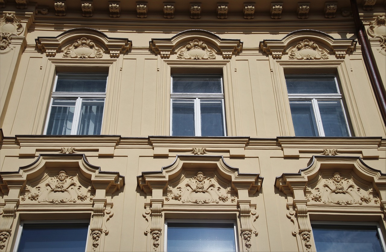 a building with a clock on the front of it, inspired by Max Švabinský, flickr, ocher details, detailed classical architecture, exterior view, benjamin vnuk