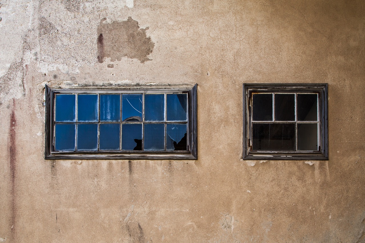 a couple of windows sitting on the side of a building, by Richard Carline, wabi - sabi, urbex photography, blues, f / 1. 9 6. 8 1 mm iso 4 0