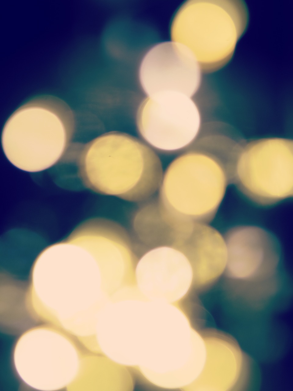 a blurry photo of a bunch of lights, a picture, inspired by Elsa Bleda, shutterstock, minimalism, background yellow and blue, retro effect, 4 5 mm bokeh, background image