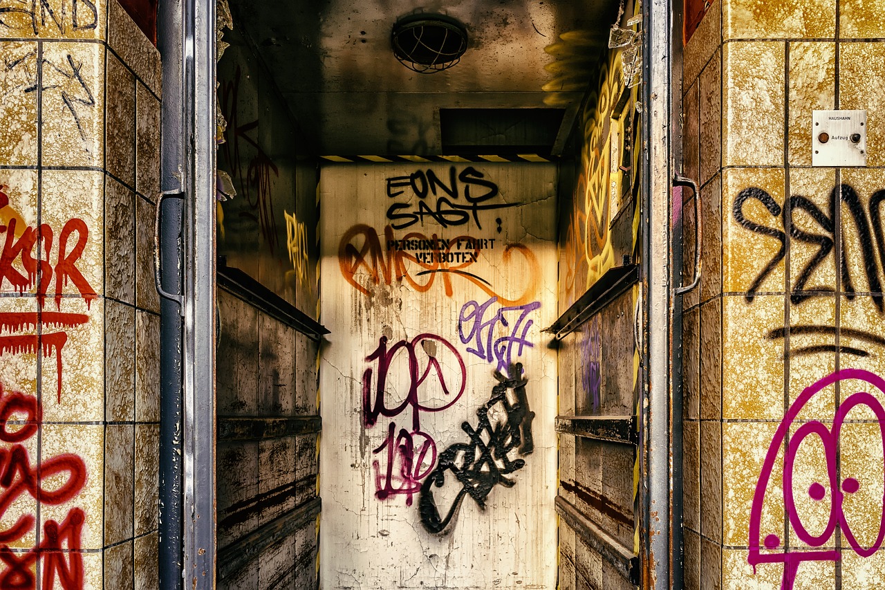 a door that has some graffiti on it, by Anton Graff, pexels, cinematic composition hdr, explode and chaos, elevator, a ghetto in germany