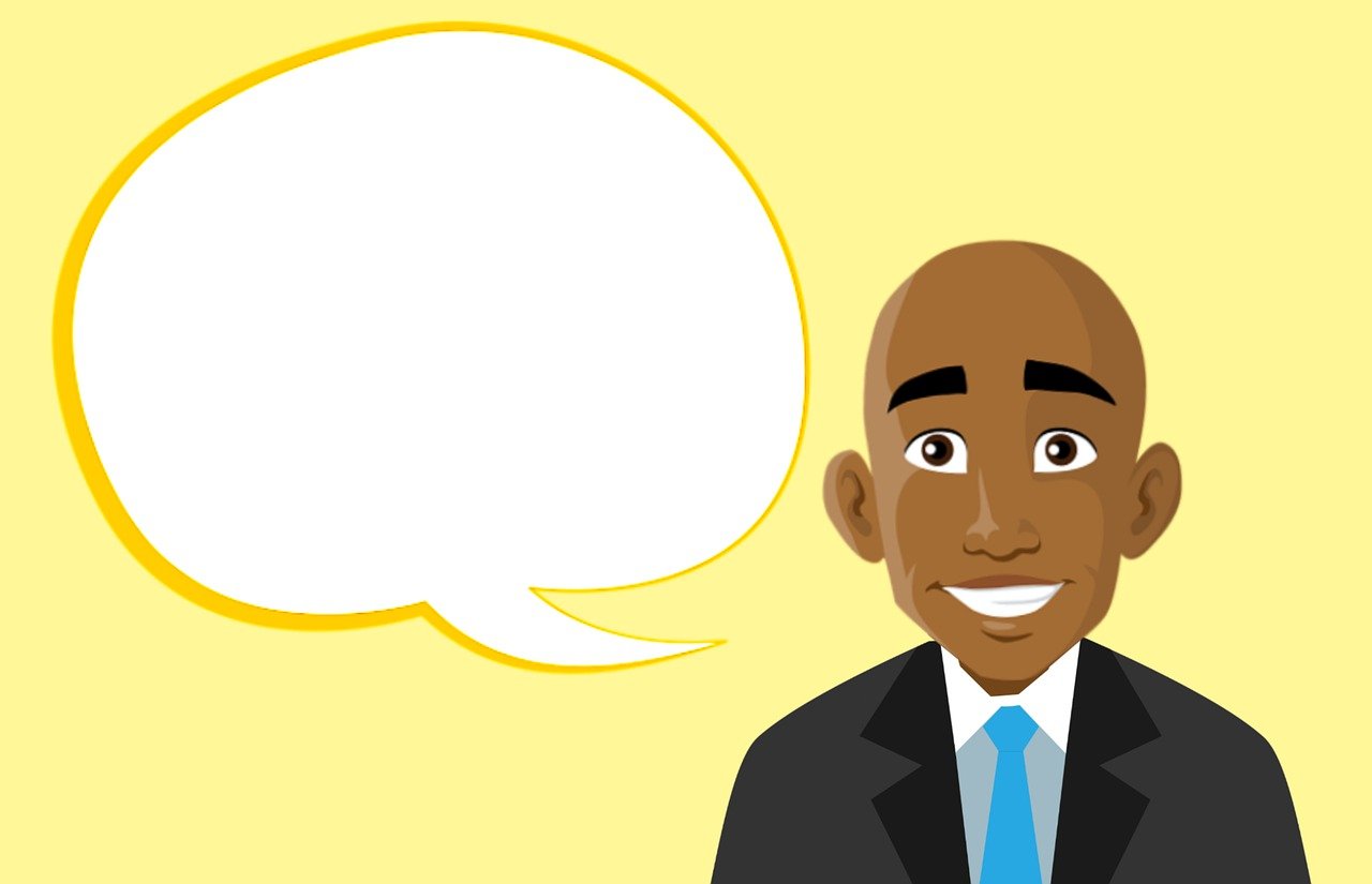 a man in a suit and tie with a speech bubble, a cartoon, by Whitney Sherman, shutterstock, jamaican, smiling expression, atiba jefferson, character portrait closeup