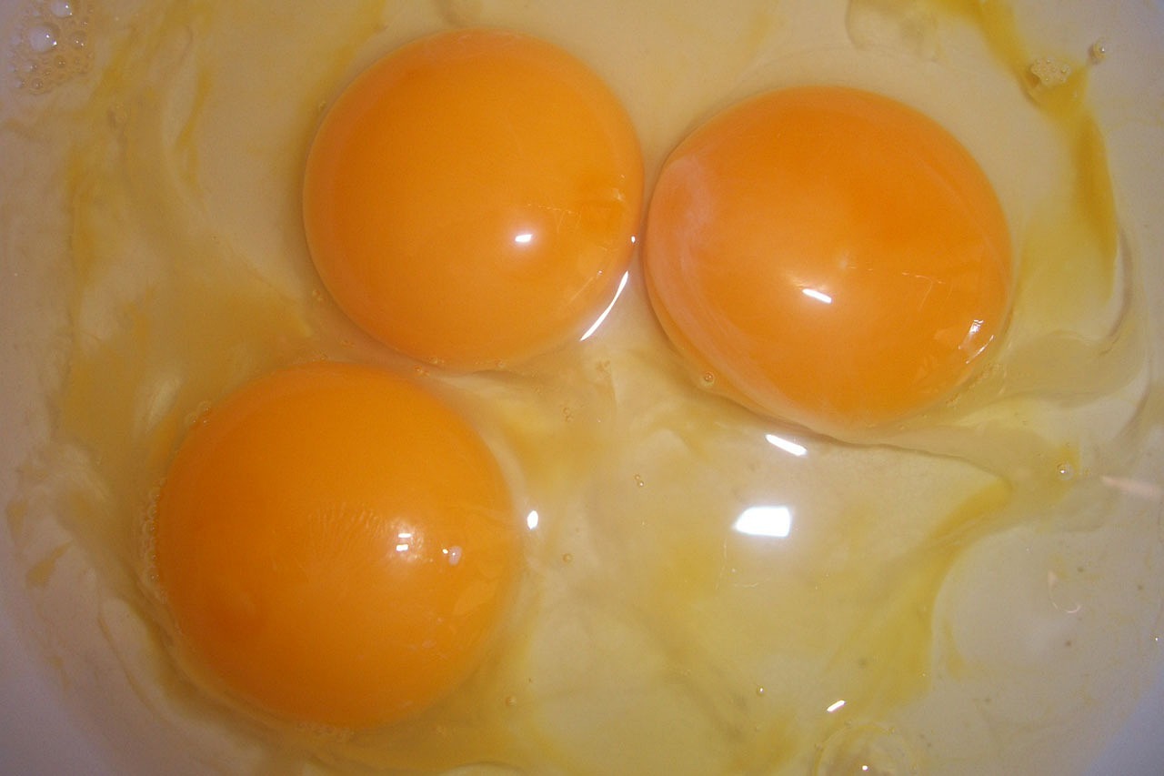 three eggs in a bowl with yogurt yogurt yogurt yogurt yogurt yogurt yogurt yo, by Jan Rustem, flickr, light orange values, [ closeup ]!!, chickens, flan