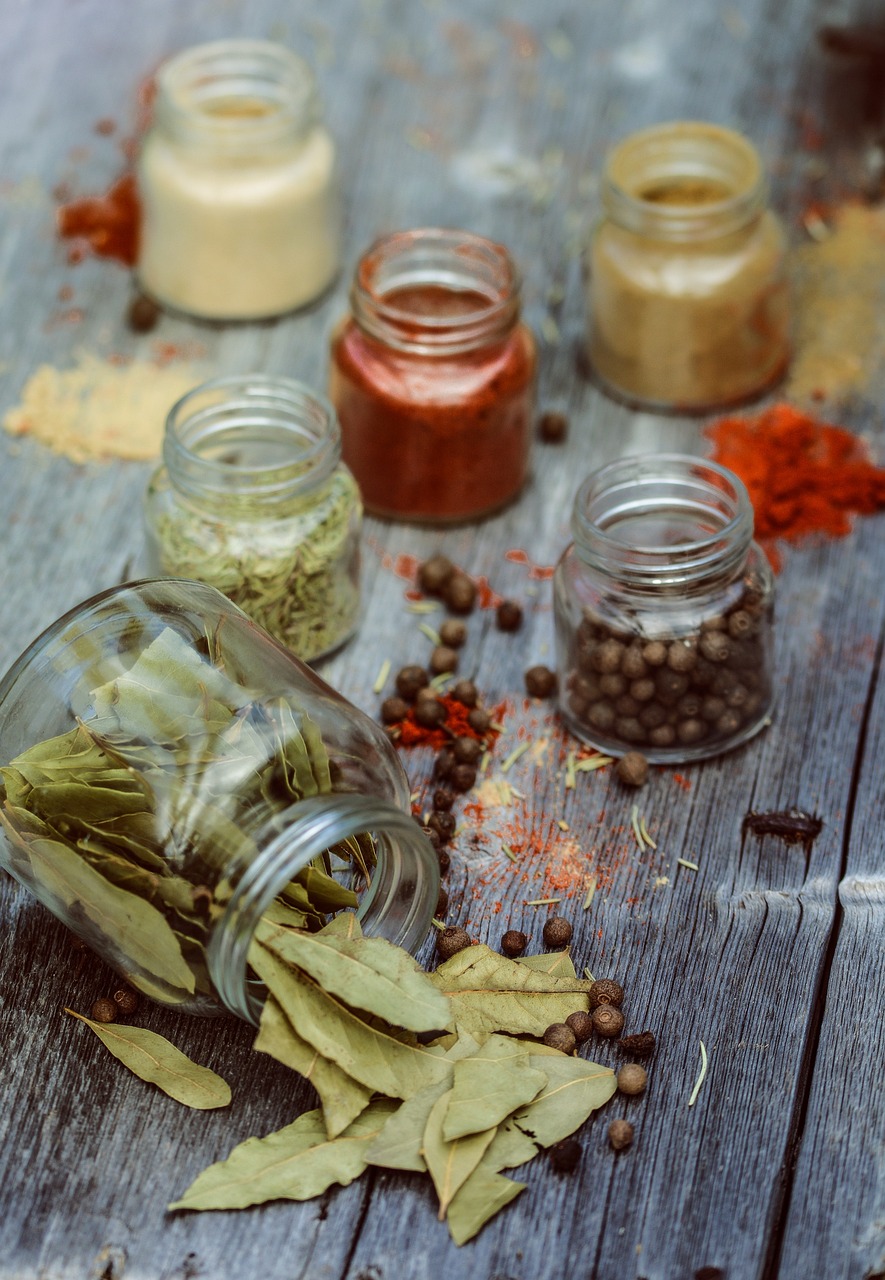 a wooden table topped with jars filled with spices, a picture, pexels, avatar image, artem, morning detail, flatlay