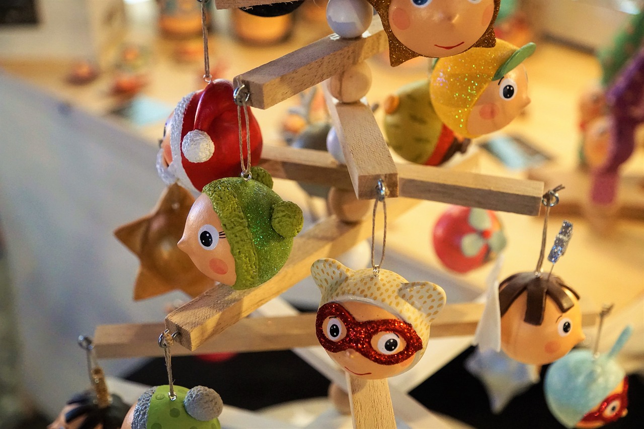 a close up of a toy tree on a table, by Zsuzsa Máthé, naive art, heads of wooden of bird face, superhero, gourmet and crafts, hanging from the ceiling