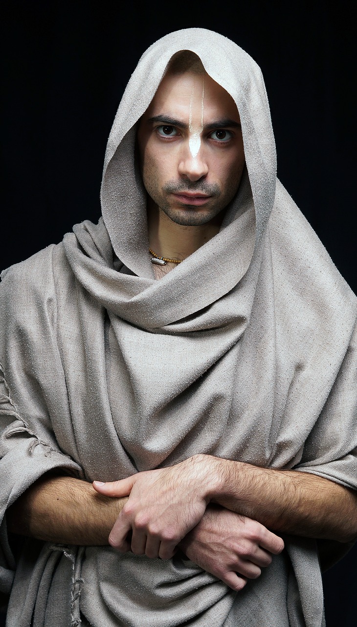 a close up of a person wearing a shawl, inspired by Taddeo Gaddi, renaissance, full body picture of a male monk, an ultra realistic photo, middle eastern, aged 2 5