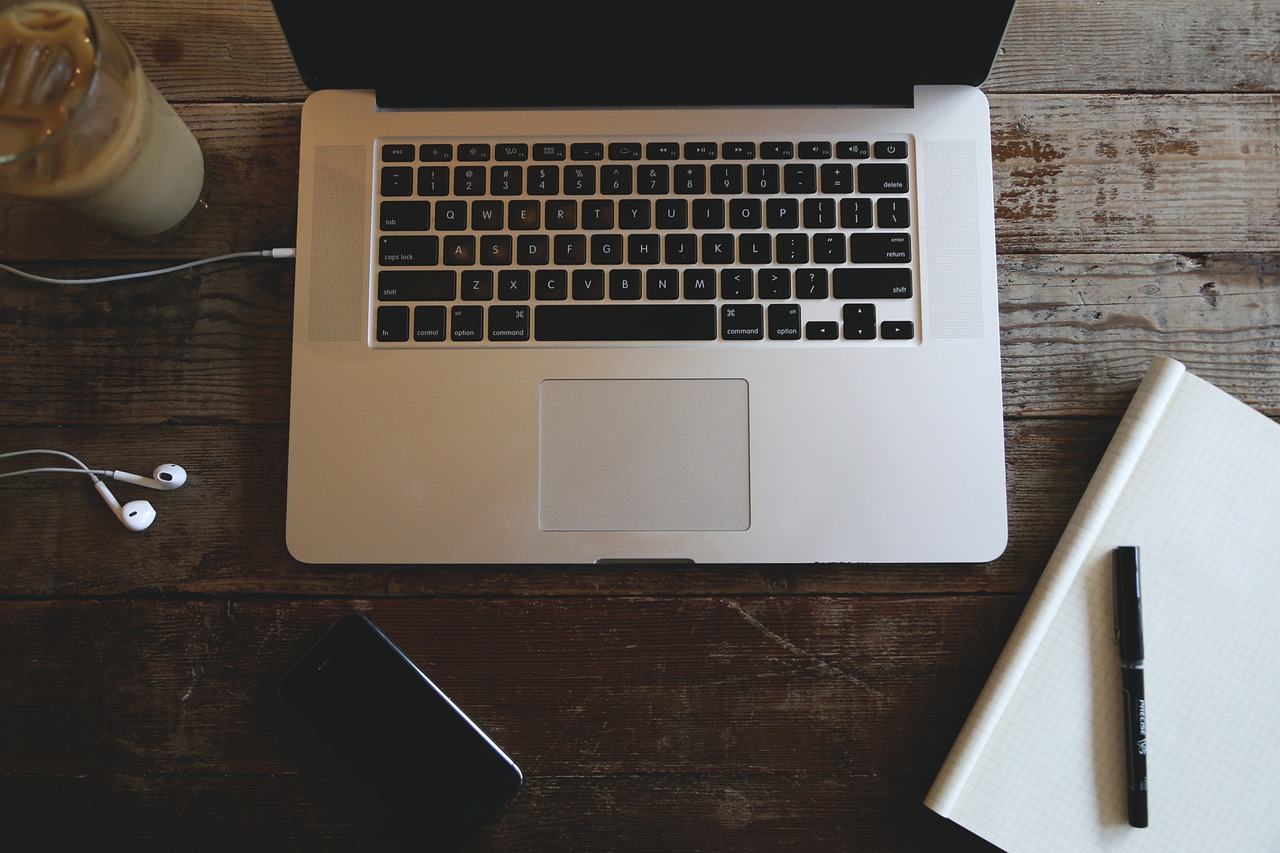 a laptop computer sitting on top of a wooden table, by Romain brook, pexels, phone photo, flatlay, stock photo, intricate ”