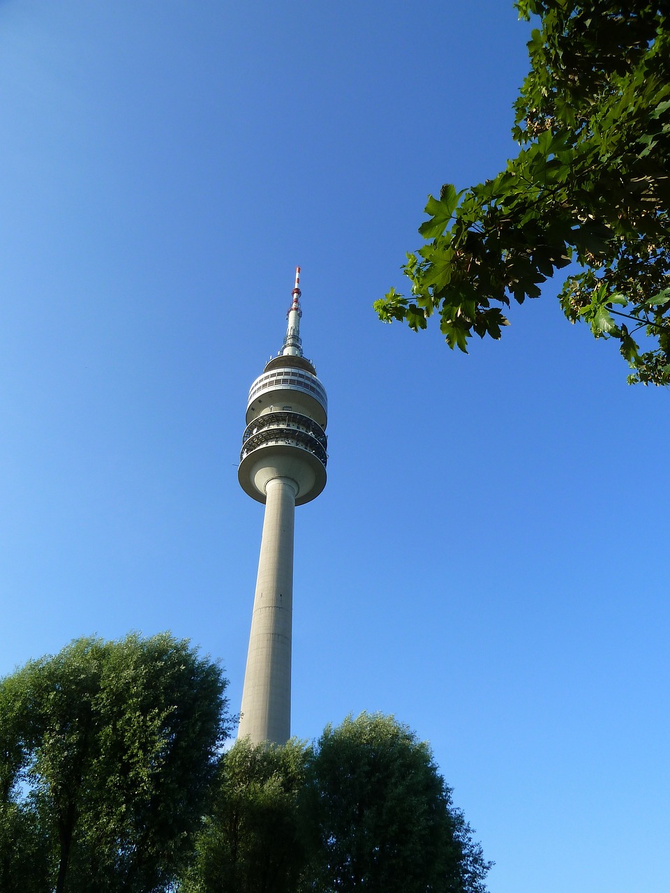 a tall tower sitting in the middle of a park, a picture, by Emanuel Büchel, flickr, k-pop, antenna, view from below, german