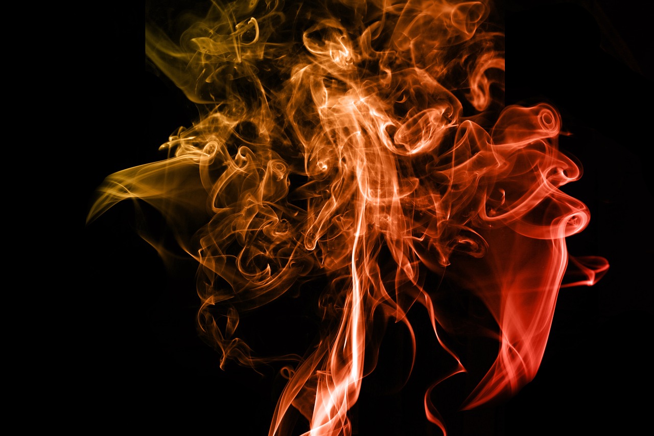 a close up of smoke on a black background, a picture, renaissance, red and orange color scheme, high res photo