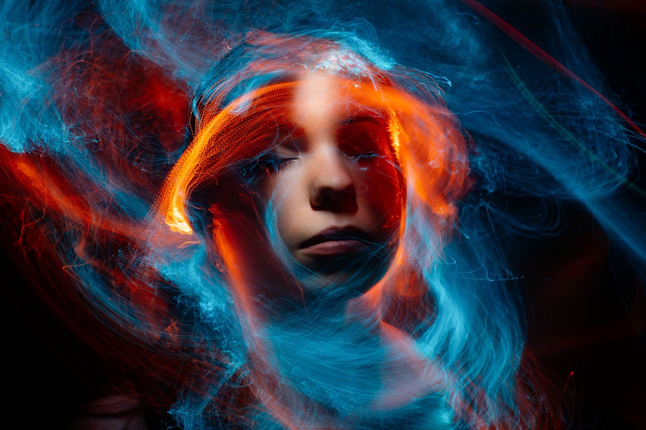 a close up of a person with red hair, a portrait, by Adam Marczyński, pexels contest winner, digital art, orange fire/blue ice duality!, she is attracting lightnings, spiraling, high quality fantasy stock photo