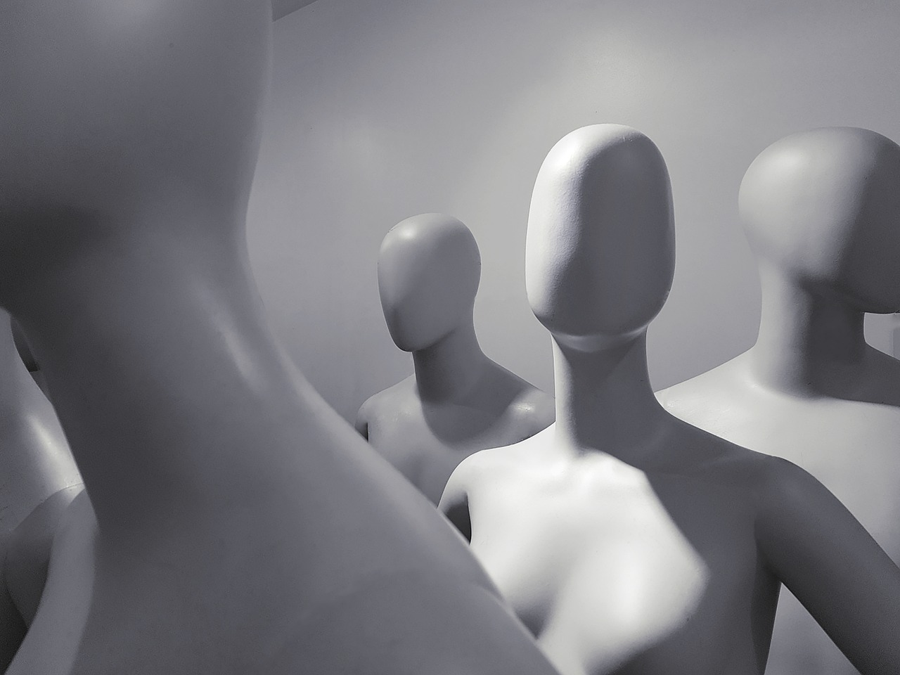 a group of mannequins standing next to each other, by Julian Allen, trending on pixabay, figurativism, white head, ambient oclusion, shot with sigma f / 4. 2, grey aliens