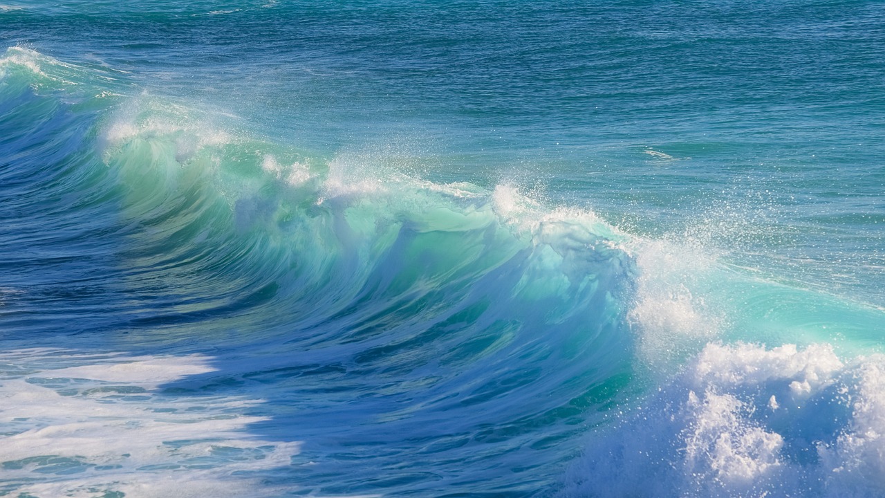 a man riding a wave on top of a surfboard, pexels, fine art, wallpaper anime blue water, glistening seafoam, wallpaper - 1 0 2 4, beautiful waves in sea