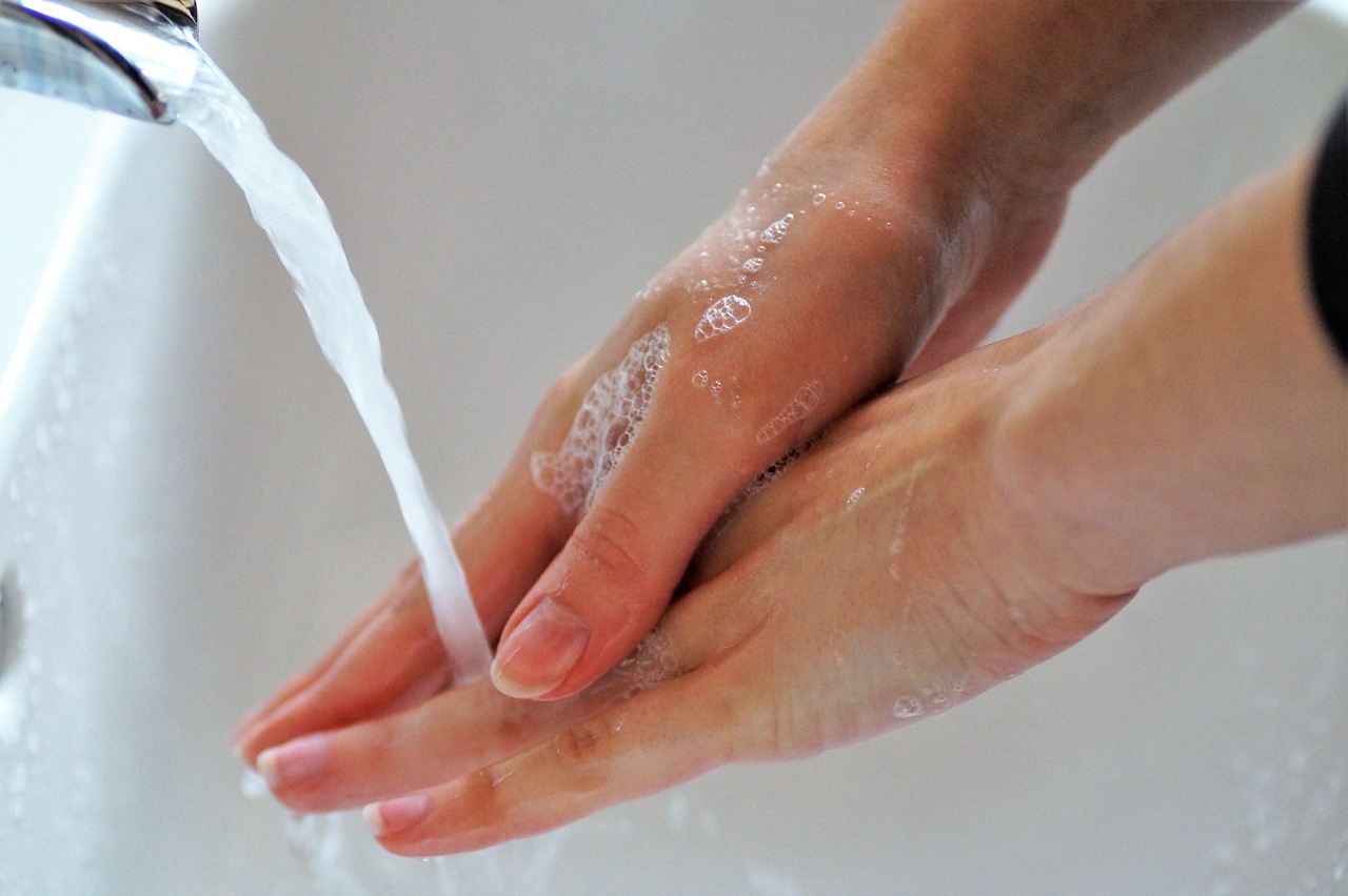 a person washing their hands under a faucet, a stipple, shiny wet skin!!, soft volume absorbation, easy to use, mikko