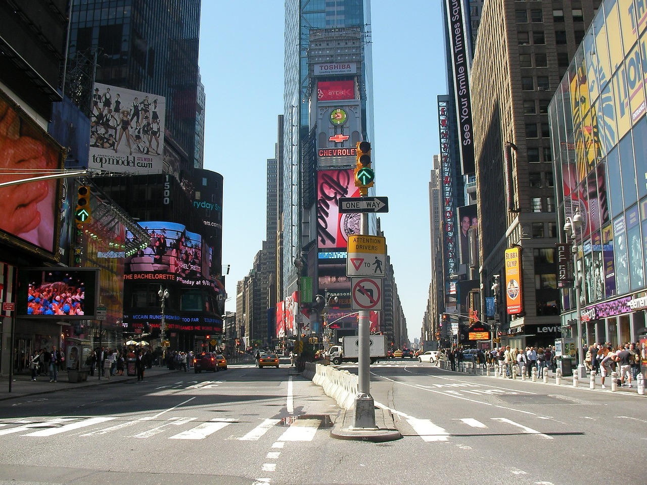 a city street filled with lots of tall buildings, a picture, time square, sign, watch photo, deserted