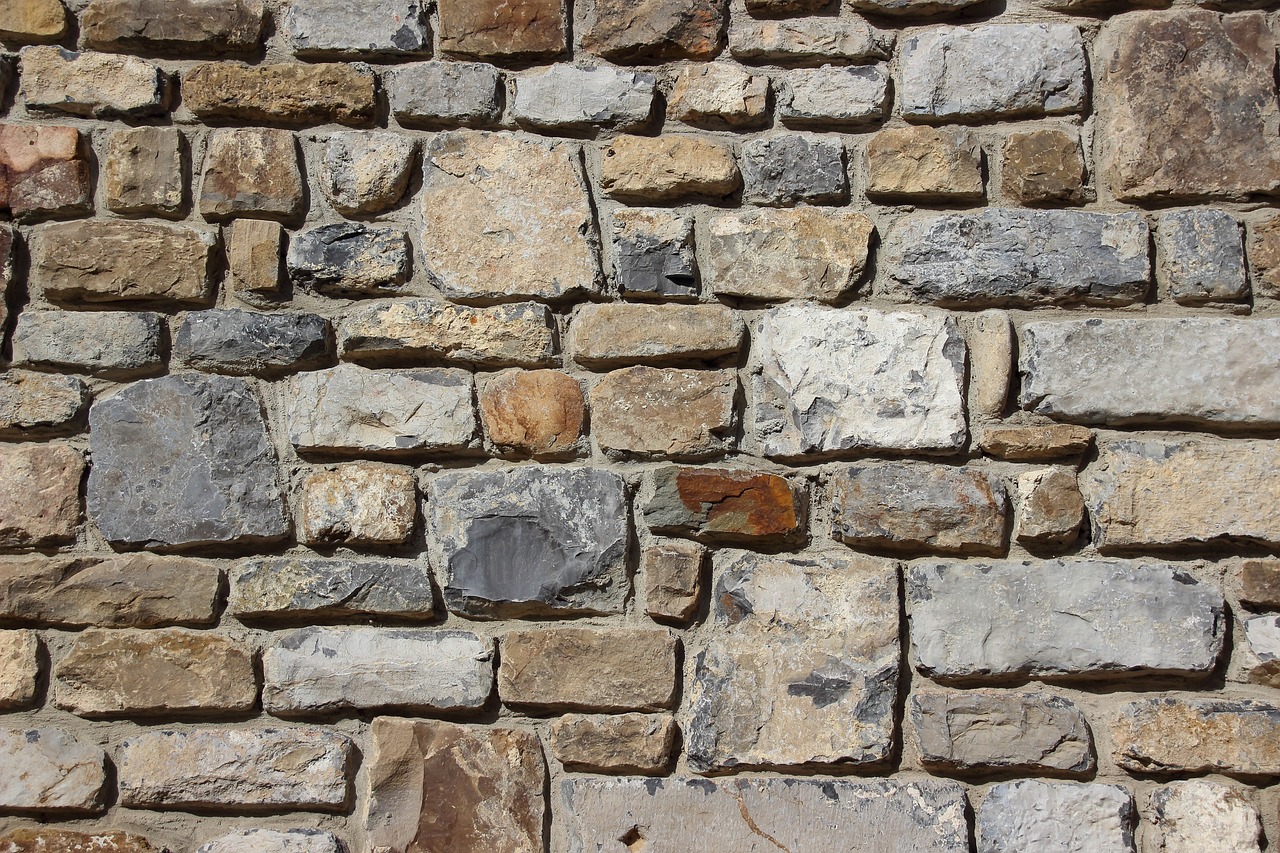 a red fire hydrant sitting in front of a stone wall, inspired by Agnes Martin, renaissance, detailed zoom photo, ((rocks)), 1789, highly detailed stonework