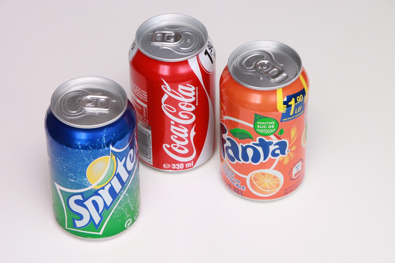 a group of soda cans sitting next to each other, a picture, flickr, photostock, frank frazeta, candies, 3 colors