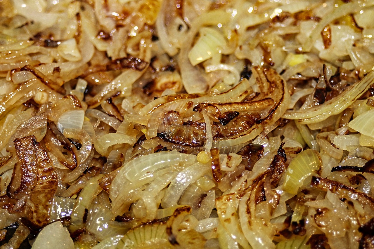 a pile of onions sitting on top of a pan, a macro photograph, shutterstock, kebab, brittle. highly detailed, high quality product image”, rice