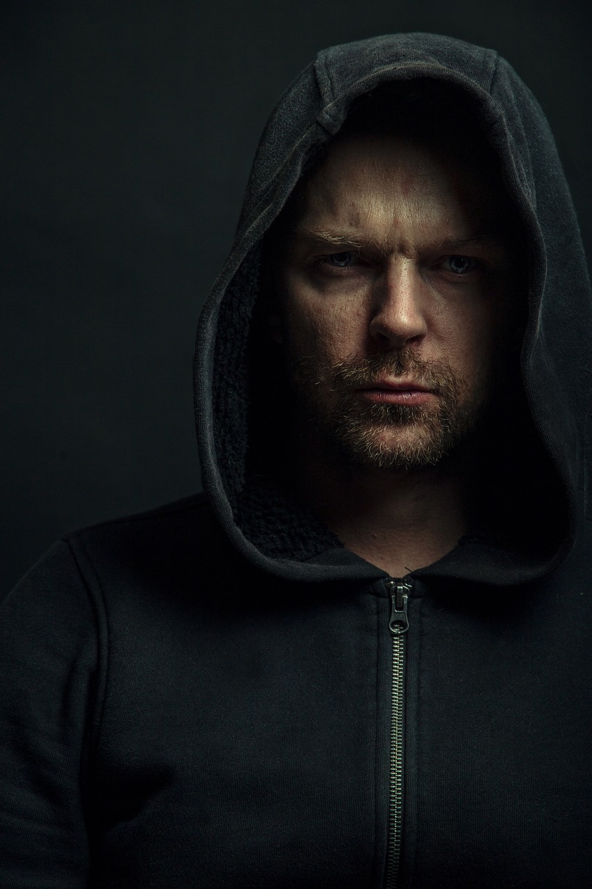 a close up of a person wearing a hoodie, a character portrait, inspired by Hallsteinn Sigurðsson, unsplash, ewan mcgregor, dark. studio lighting, karl urban, philip selway (drums)