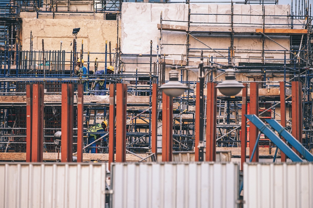 a group of construction workers working on a building, a photo, shutterstock, bauhaus, industrial rusty pipes, colour corrected, outdoor photo, 🦩🪐🐞👩🏻🦳