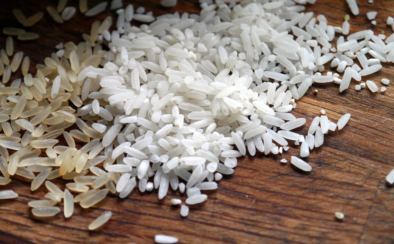 a pile of rice sitting on top of a wooden table, white hairs, ffffound, high quality product image”, test