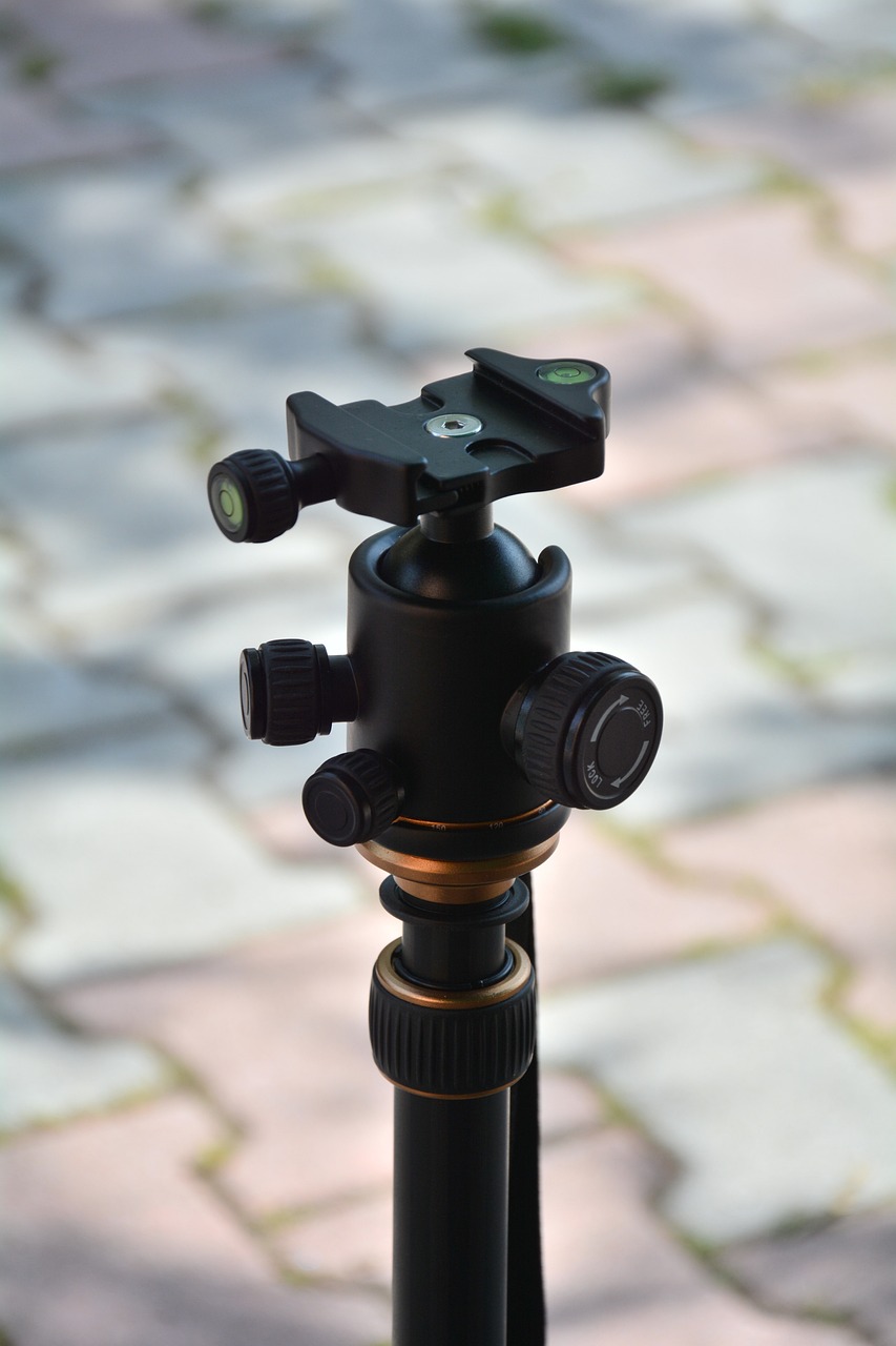 a close up of a camera on a tripod, by János Nagy Balogh, shutterstock, photorealism, drone camera lens orbs, photorealistic - h 6 4 0, very detailed picture, laser beam ; outdoor