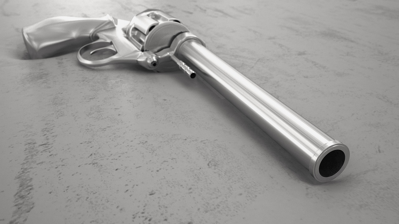 a gun that is laying on the ground, an ambient occlusion render, photorealism, stainless steal, pixar. octane render, arnold renderer, realistic lance