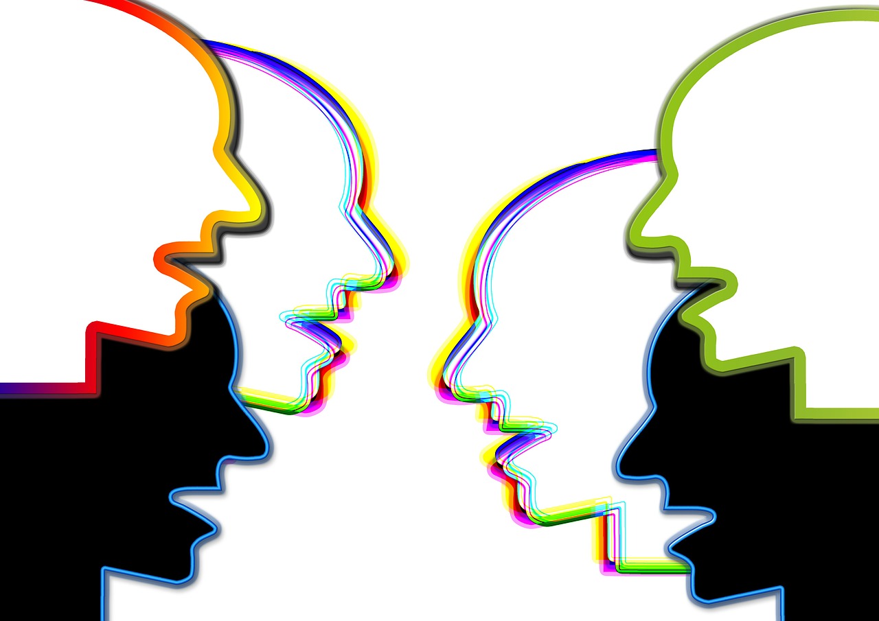 a couple of people standing next to each other, a digital rendering, trending on pixabay, synchromism, multicolored faces, facing each other, outlined silhouettes, looking at each other mindlessly