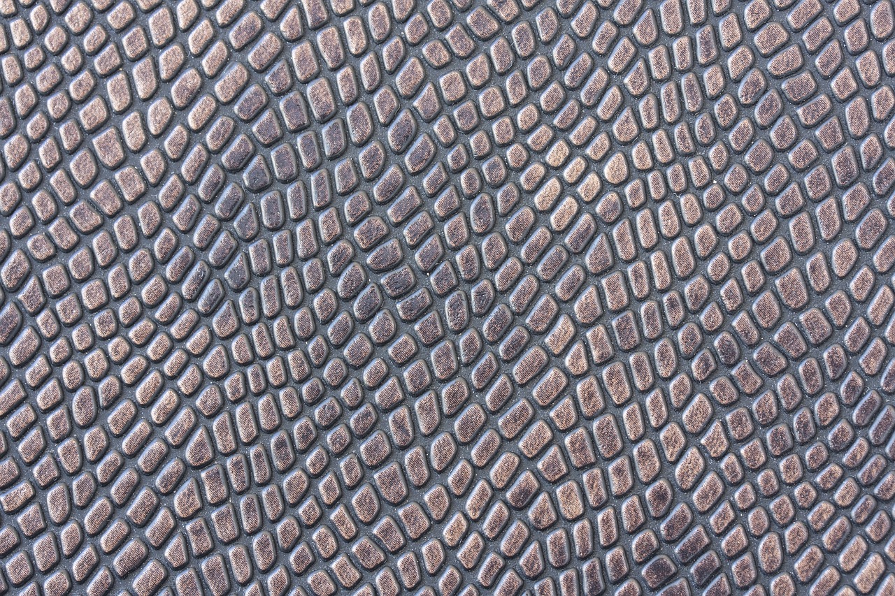 a close up of a snake skin pattern, bronze, cobblestone, high detail product photo