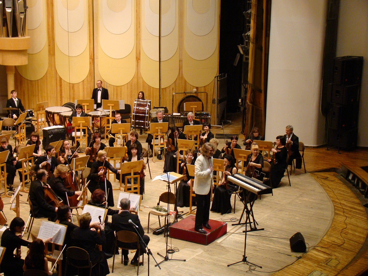 a group of people that are standing in a room, by Líviusz Gyulai, flickr, orchestra, a wooden, complex composition!!, concert