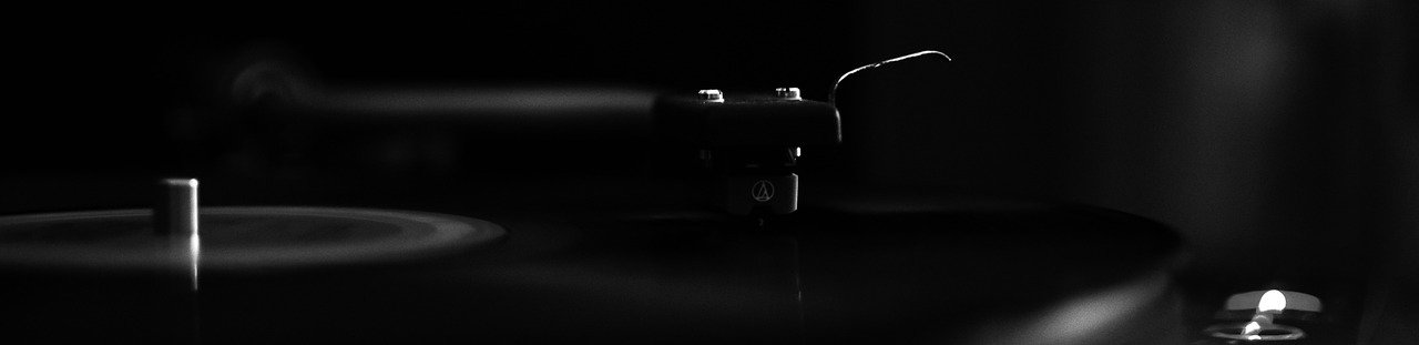 a toothbrush sitting on top of a table next to a candle, a black and white photo, inspired by Niko Henrichon, unsplash, minimalism, turntables, marble!! (eos 5ds r, firearms photography, black lacquer