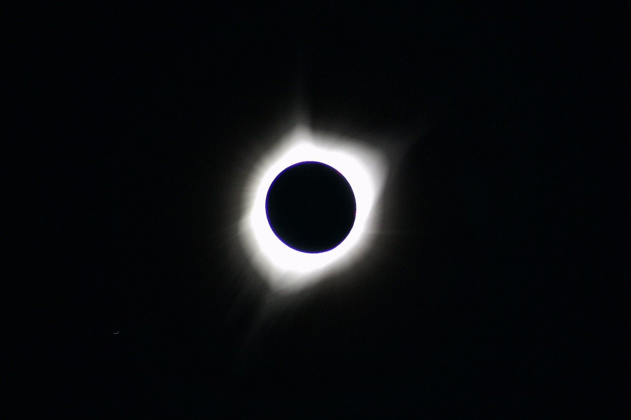 a black and white photo of a solar eclipse, a picture, by Dennis Ashbaugh, hurufiyya, wikimedia, prize winning color photo, cell phone photo, corona