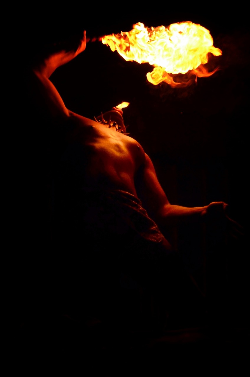 a man is performing a fire show in the dark, a photo, figuration libre, the god hephaestus, naga-tirr, museum quality photo, very accurate photo