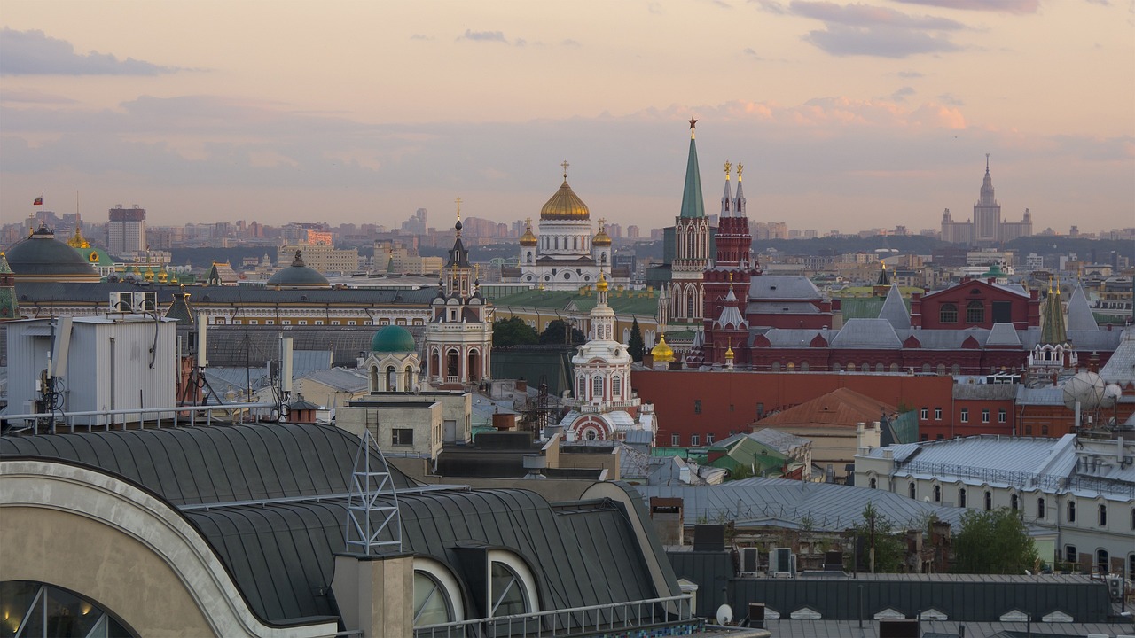 a view of a city from the top of a building, by Serhii Vasylkivsky, shutterstock, moscow kremlin, late summer evening, taken with a pentax k1000, russian temple
