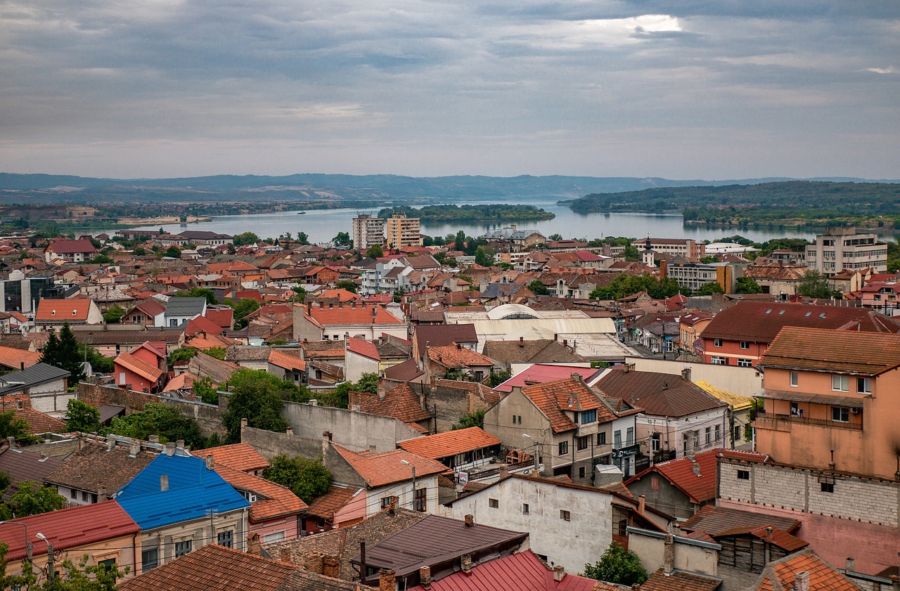 a view of a city from the top of a hill, by Hristofor Žefarović, full res, high res photo, tourist destination, wide river and lake