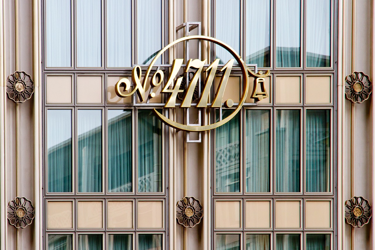 a sign that is on the side of a building, an art deco sculpture, by Nils Hamm, art nouveau, golden number, 7 7 7 7, an 9 4, official store photo