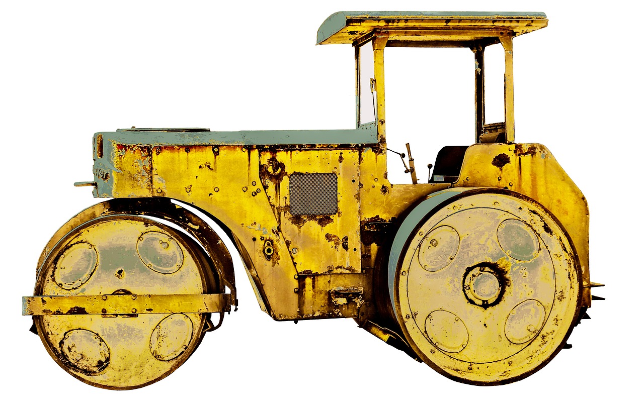 a yellow toy tractor sitting on top of a white surface, a digital rendering, pixabay, pop art, with vestiges of rusty machinery, istockphoto, massive construction machines, cart wheels