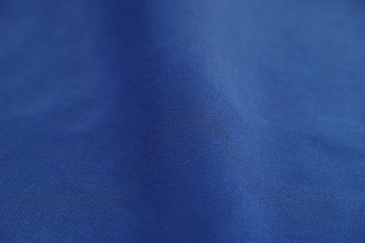 a close up view of a blue fabric, inspired by Yves Klein, unsplash, blue tight tshirt, highly detailed product photo, product introduction photo, from 8 k matte