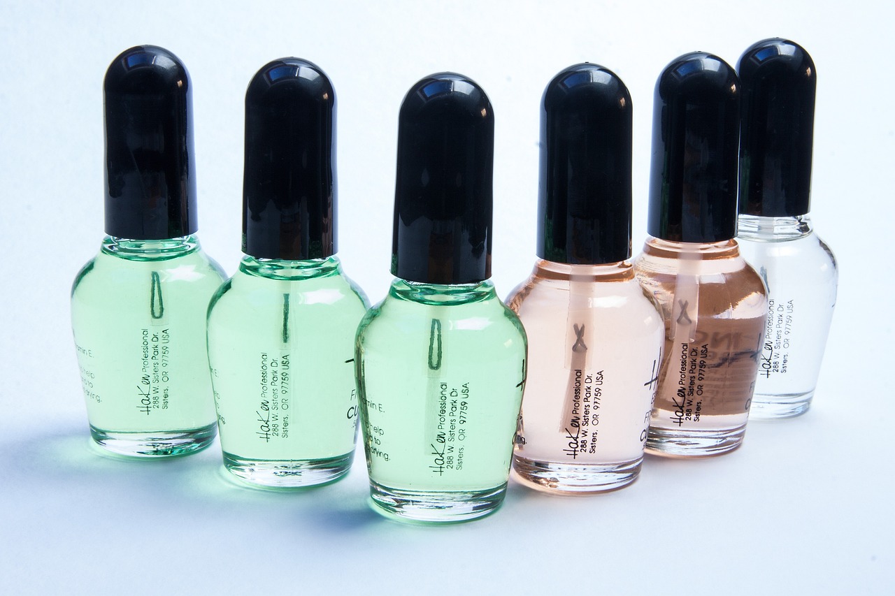 a group of four bottles of perfume sitting next to each other, by Andrei Kolkoutine, flickr, les nabis, long nails, glass paint, panzer, professional product photo