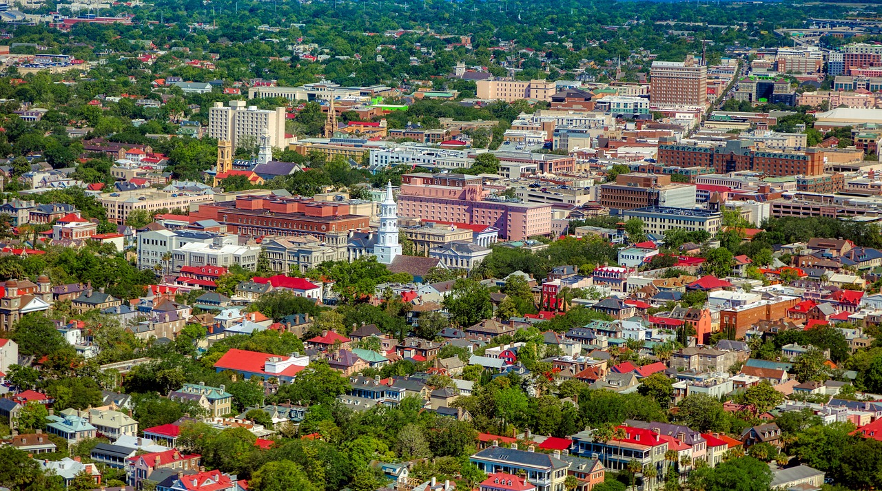 a view of a city from a bird's eye view, by Dave Melvin, in savannah, high color saturation, hi resolution, white buildings