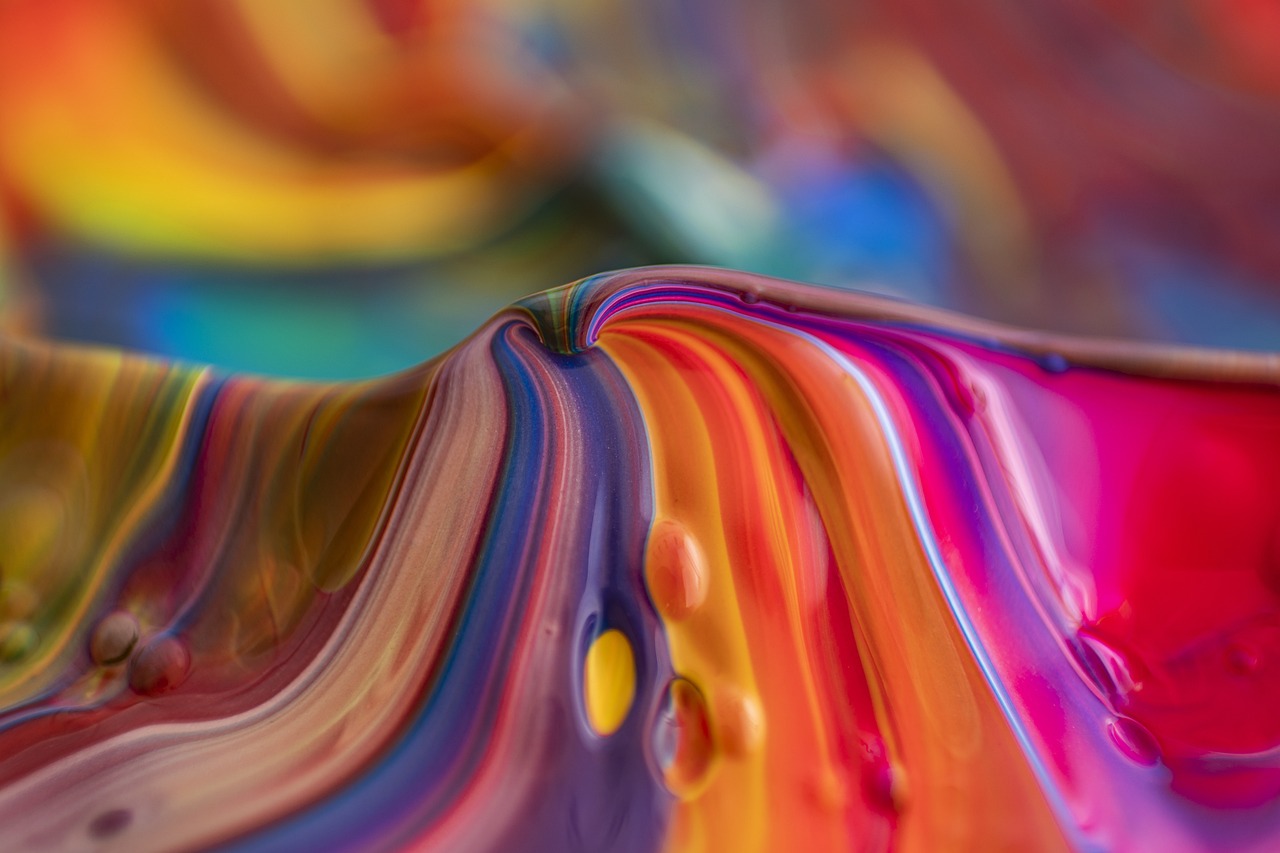 a close up of a colorful swirl of paint, a photorealistic painting, captured on canon eos r 6, dressed in colorful silk, organic flowing background, product photography 4 k