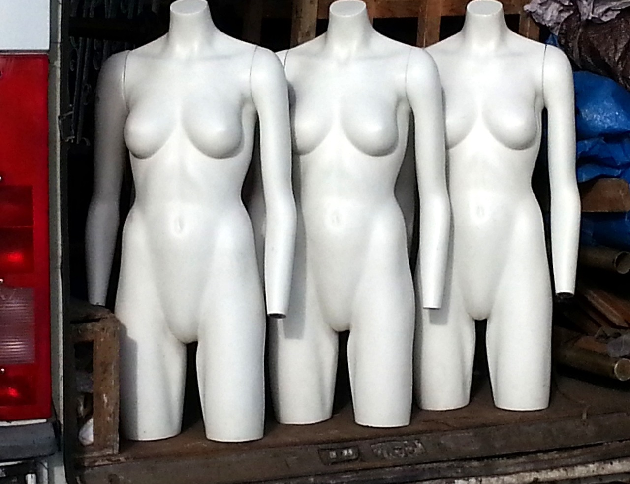 three mannequins sitting in the back of a truck, a statue, inspired by Vanessa Beecroft, flickr, symmetry!!!, pale milky white porcelain skin, standing straight, many smooth curves