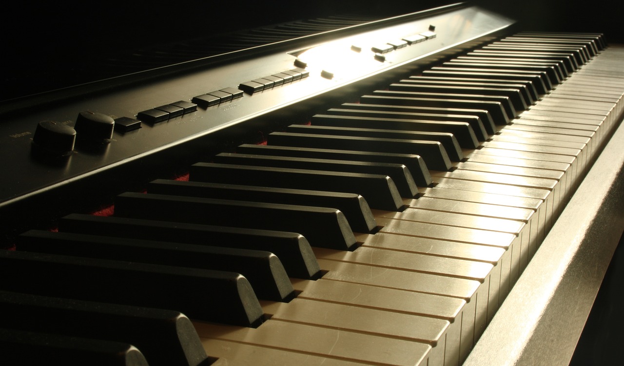 a close up of the keys of a piano, a picture, by Robert Medley, shutterstock, dramatic lighting”, vertical wallpaper, kodak photo, taken with a pentax1000