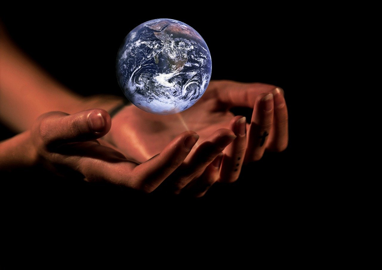 a person holding the earth in their hands, by Jan Rustem, precisionism, avatar image, flikr, beautiful hands, 2 0 1 0 photo
