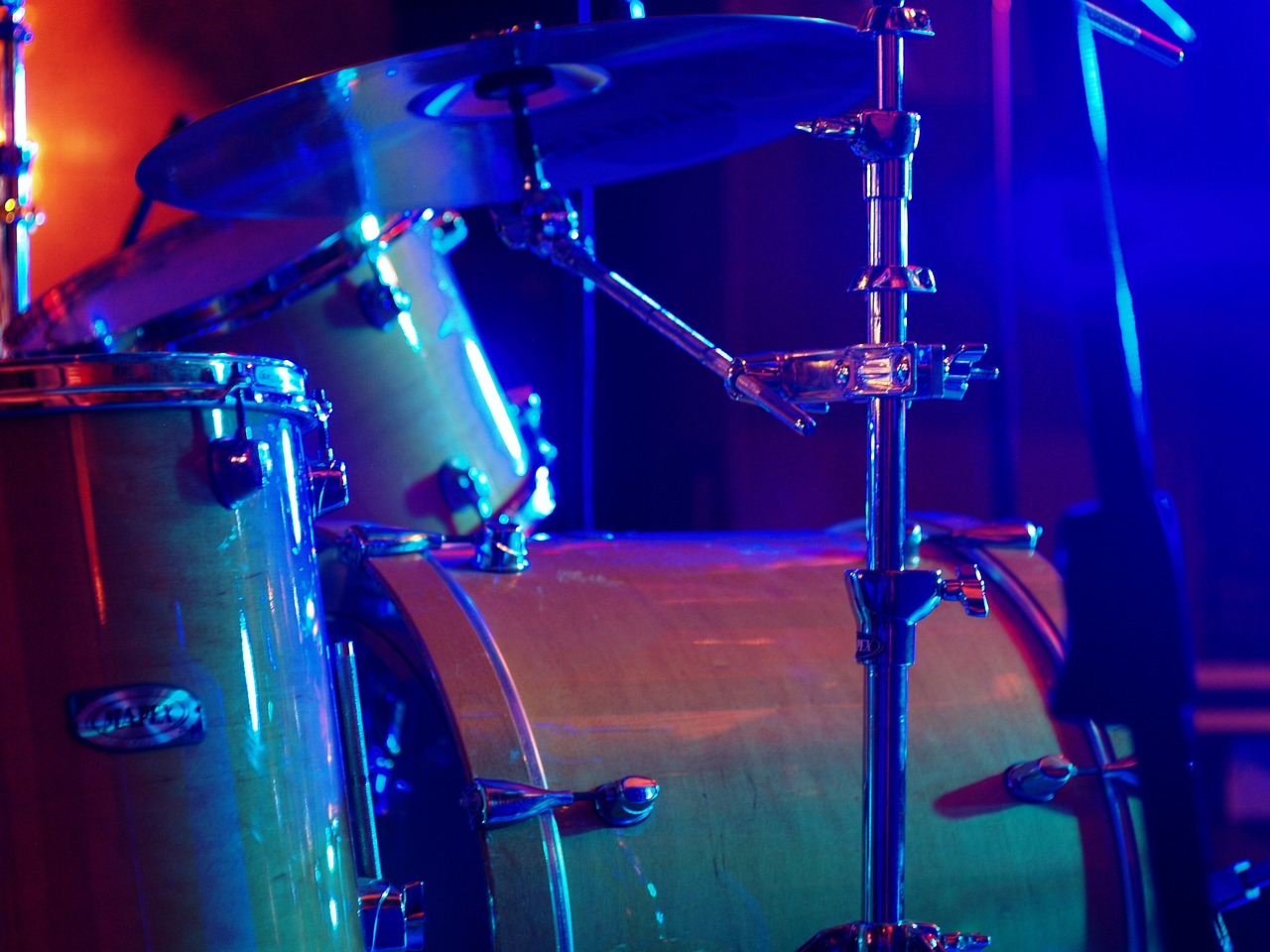 a close up of a drum on a stage, a portrait, shutterstock, modern very sharp photo, blue and yellow lighting, stock photo