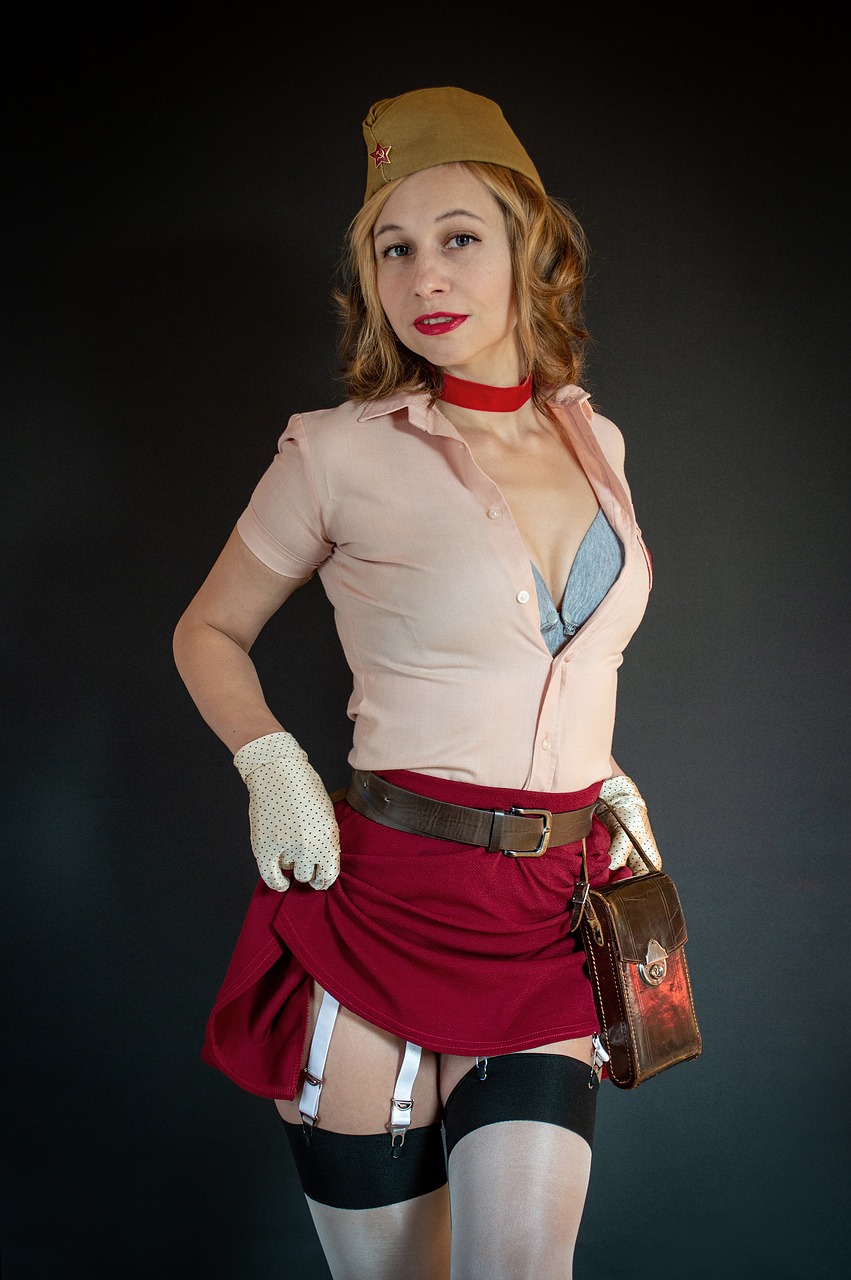 a woman in a uniform posing for a picture, a portrait, inspired by Gil Elvgren, tumblr, faye valentine from cowboy bebop, freddy krueger style, with two front pockets, betty cooper