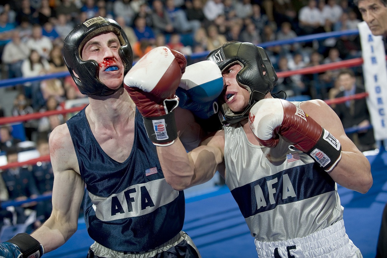 a couple of men standing next to each other in a boxing ring, spit flying from mouth, afp, arney fretag, aaron fallon