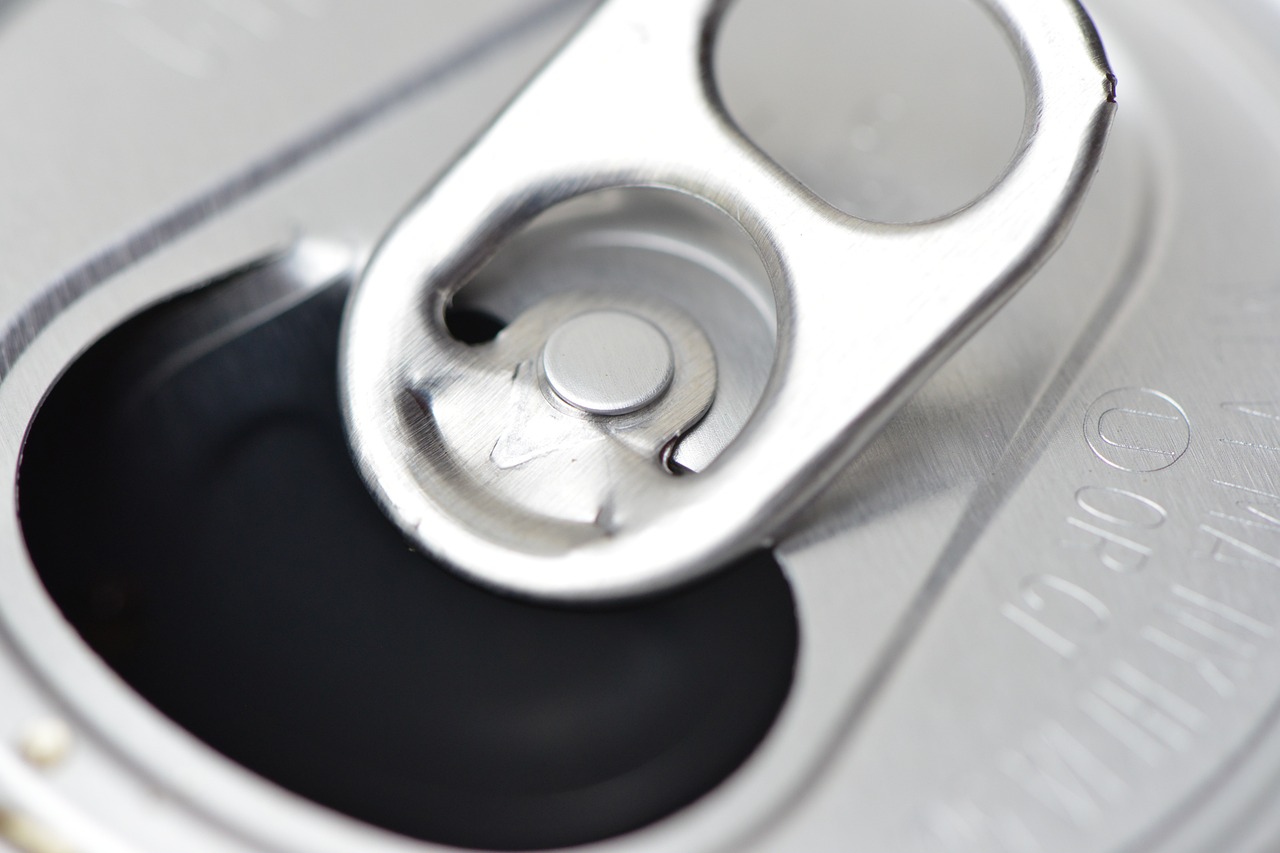 a close up of a can of soda, a picture, by Thomas Häfner, mechanical implants, open top, key is on the center of image, product introduction photo