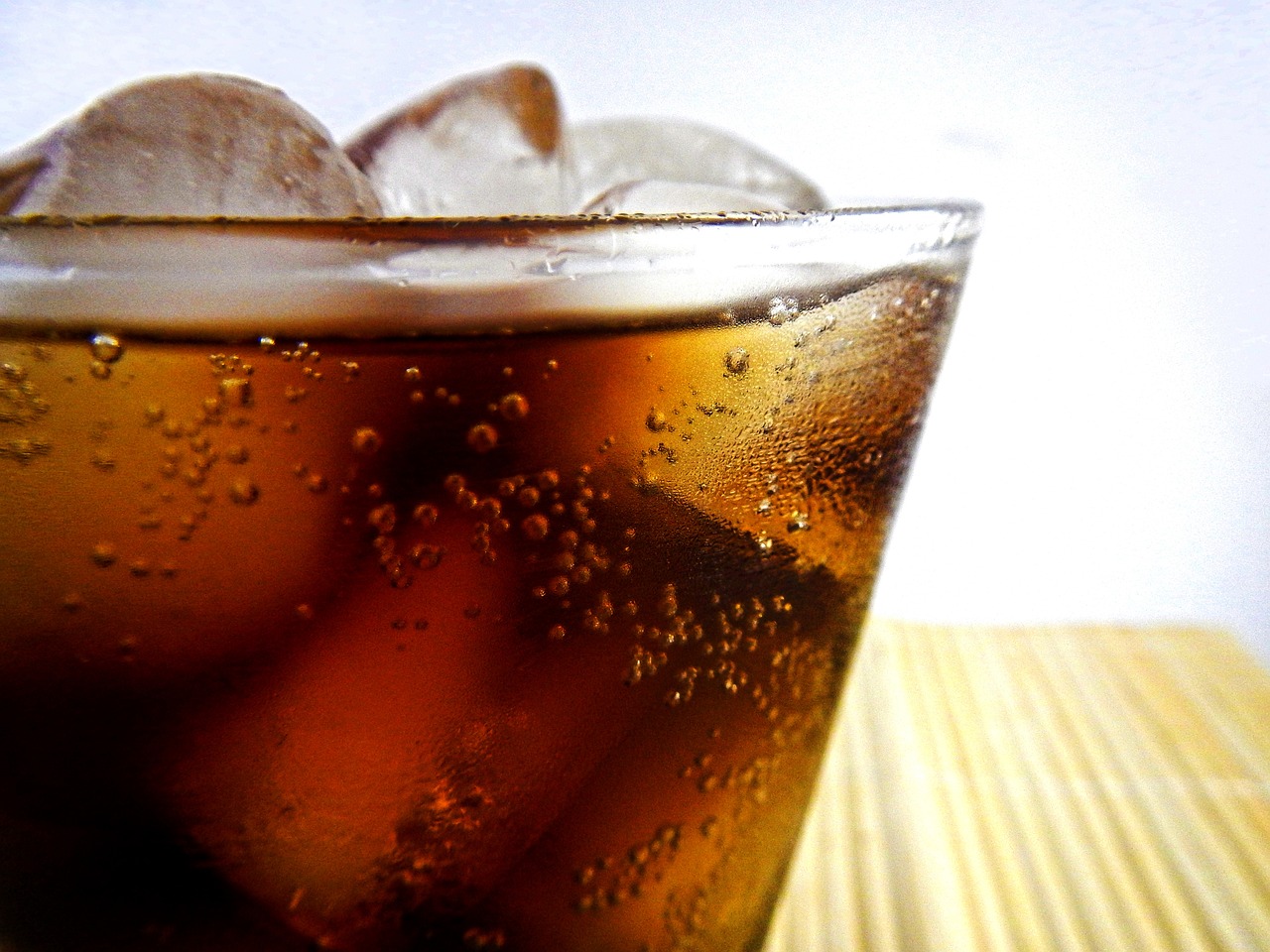 a glass of soda with ice cubes in it, inspired by Dorothy Coke, beautiful angle, slush)), smooth!], smooth.sharp focus