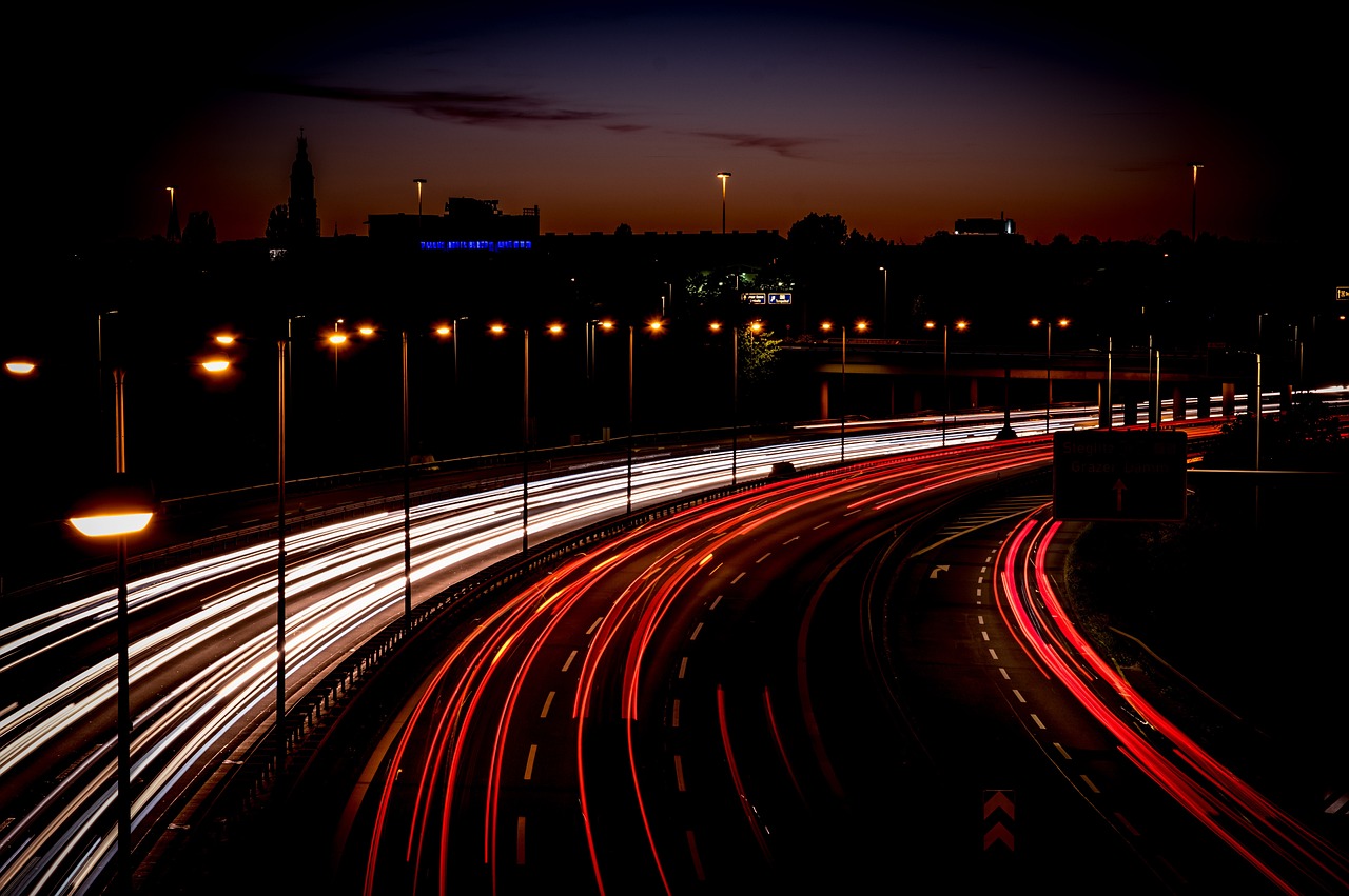 a city street filled with lots of traffic at night, a picture, by Niels Lergaard, flickr, highway and sunset!!, light traces, summer night, shot with sony alpha