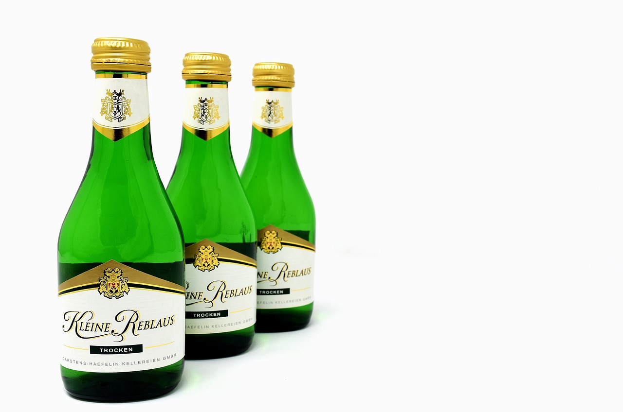 three bottles of wine sitting next to each other, inspired by Hermann Rüdisühli, renaissance, miniature product photo, sparkling water, rossier, with a white background